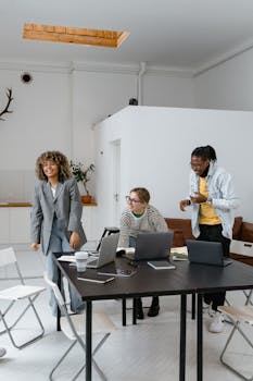 Lively business meeting with a diverse team collaborating in a stylish office.